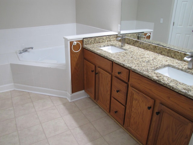 bathroom with a bath, tile patterned flooring, a sink, and double vanity