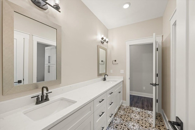 bathroom with tile patterned flooring and vanity