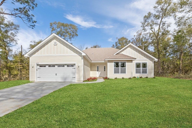 view of front facade with a garage and a front yard