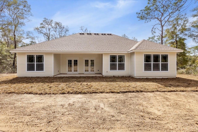 back of property featuring a patio area and french doors