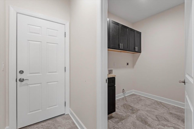 laundry room featuring cabinets, hookup for an electric dryer, and hookup for a washing machine