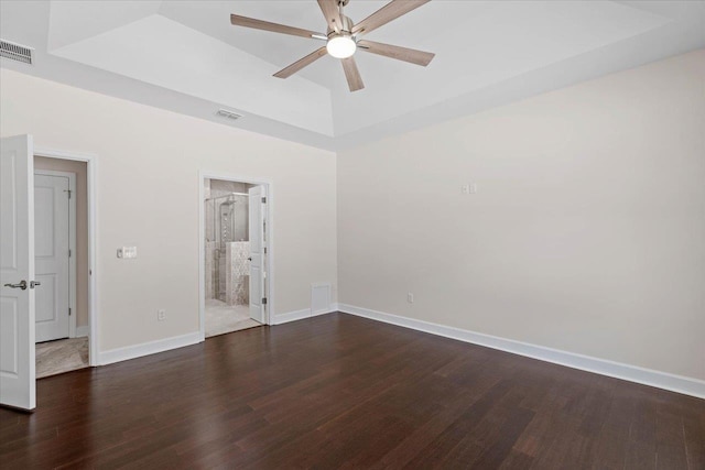 unfurnished room featuring ceiling fan and dark hardwood / wood-style flooring