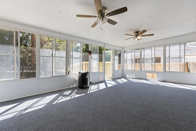 unfurnished sunroom with ceiling fan and plenty of natural light