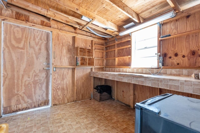 interior space featuring wood walls