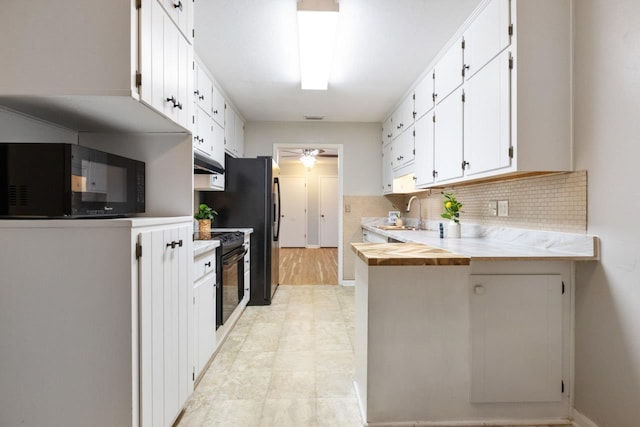 kitchen featuring white cabinets, ceiling fan, black appliances, and decorative backsplash