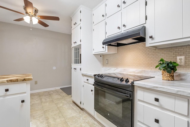 kitchen with black range with electric stovetop, tasteful backsplash, and white cabinetry