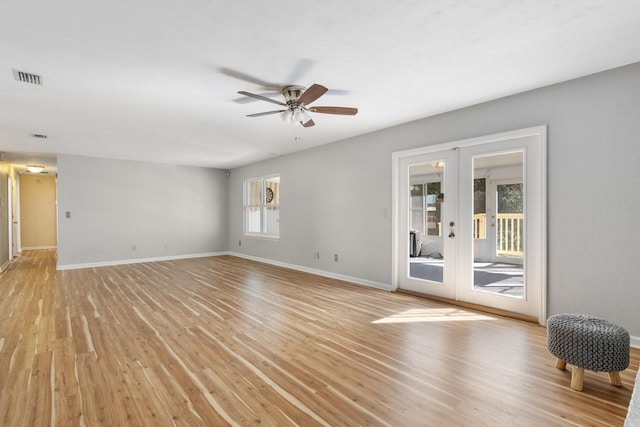 unfurnished room featuring ceiling fan, french doors, and light hardwood / wood-style floors