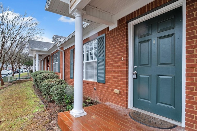 doorway to property with a porch