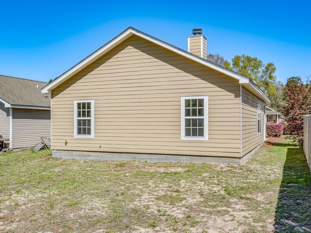 325 Chastain Ln, Tallahassee, FL 32305 - view of side of home featuring a chimney and a yard