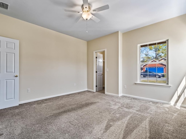 325 Chastain Ln, Tallahassee, FL 32305 - unfurnished bedroom featuring baseboards, visible vents, carpet floors, and a ceiling fan
