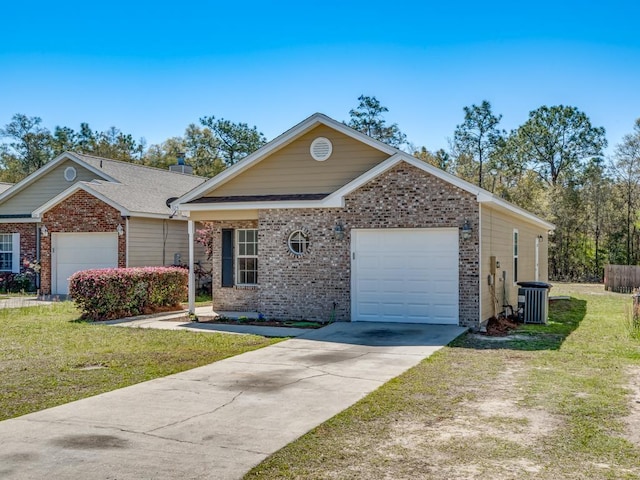 325 Chastain Ln, Tallahassee, FL 32305 - view of front facade featuring driveway, a front yard, central AC, brick siding, and a garage