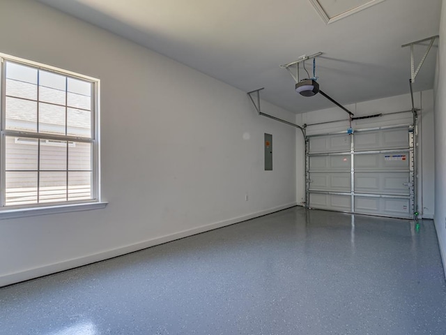 325 Chastain Ln, Tallahassee, FL 32305 - garage featuring baseboards, a garage door opener, and electric panel