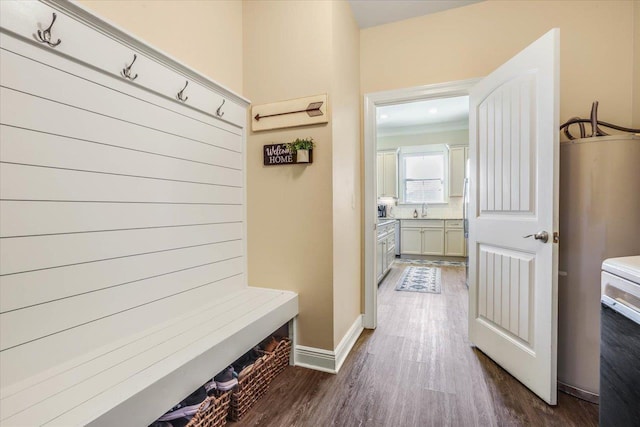 mudroom with dark hardwood / wood-style flooring and sink