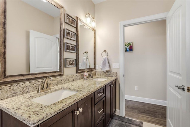 bathroom featuring vanity and hardwood / wood-style floors