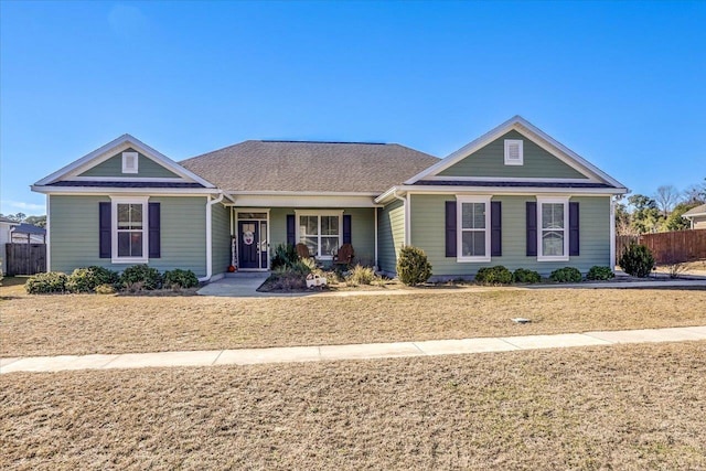 view of front facade with a front lawn and a porch