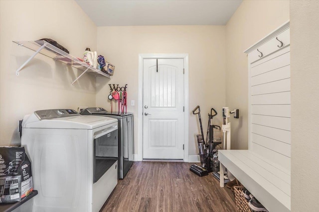 laundry area featuring dark wood-type flooring and washer and dryer