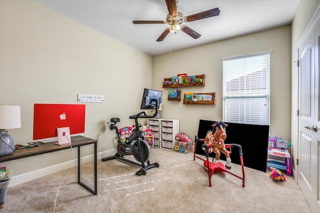 interior space with ceiling fan and carpet flooring