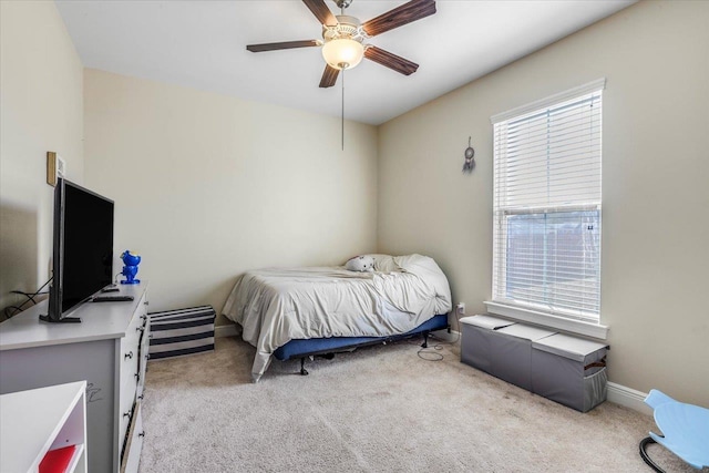 carpeted bedroom featuring ceiling fan