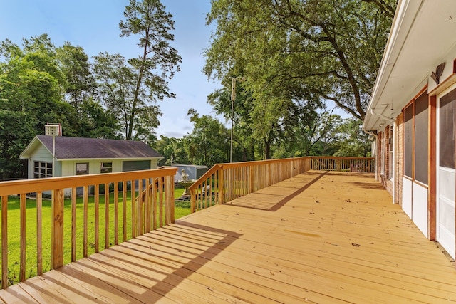 wooden deck with a lawn