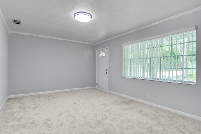 carpeted empty room with ornamental molding