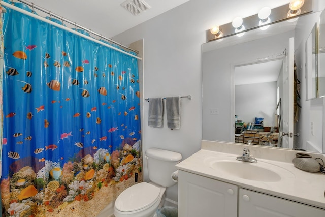 bathroom featuring a shower with curtain, visible vents, vanity, and toilet