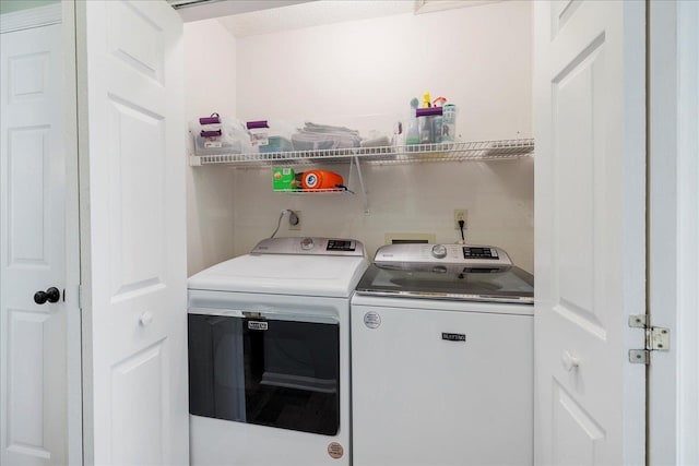 laundry area featuring laundry area and separate washer and dryer