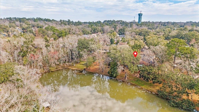 aerial view featuring a water view and a view of trees