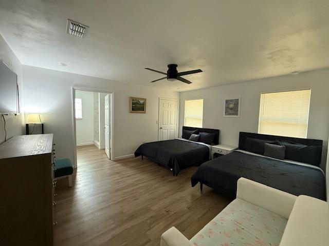 2754 Roberts Ave, Tallahassee, FL 32310 - bedroom with visible vents, baseboards, wood finished floors, and ceiling fan