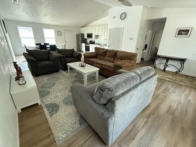 2754 Roberts Ave, Tallahassee, FL 32310 - living room featuring vaulted ceiling and light wood finished floors