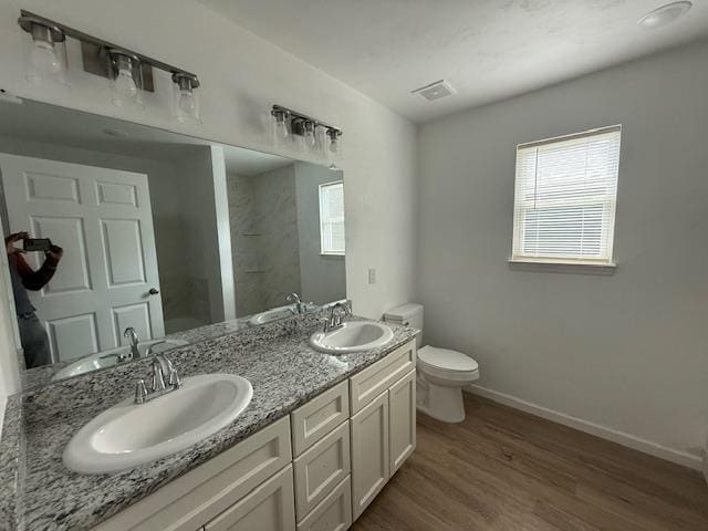 2754 Roberts Ave, Tallahassee, FL 32310 - full bath with toilet, wood finished floors, and a sink