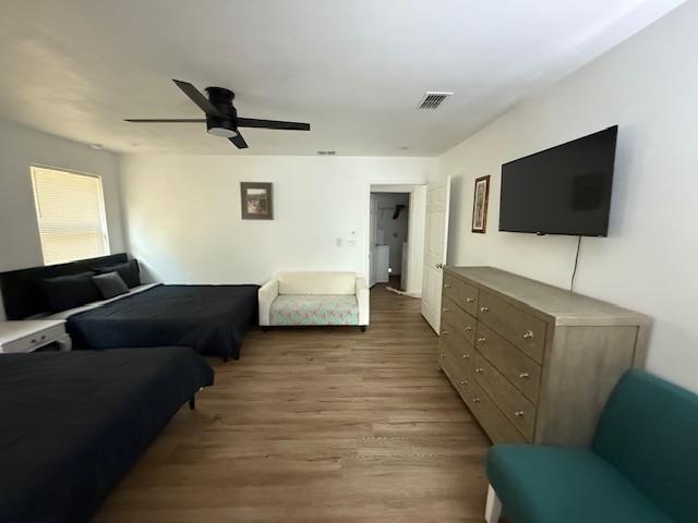 2754 Roberts Ave, Tallahassee, FL 32310 - living area with wood finished floors, visible vents, and ceiling fan