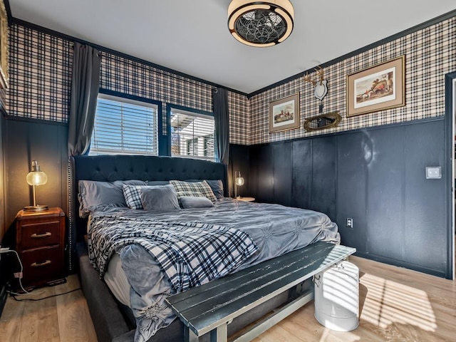 bedroom with hardwood / wood-style flooring