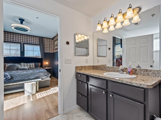 bathroom featuring vanity and hardwood / wood-style flooring