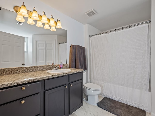 bathroom featuring vanity, curtained shower, and toilet