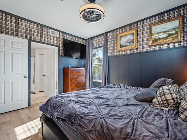 bedroom with light hardwood / wood-style flooring