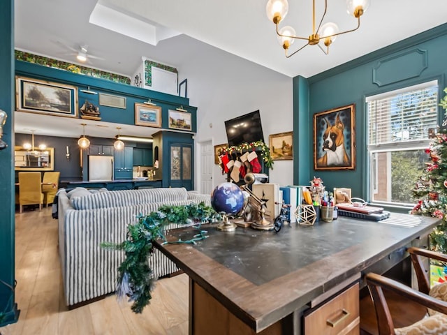 interior space with ceiling fan with notable chandelier