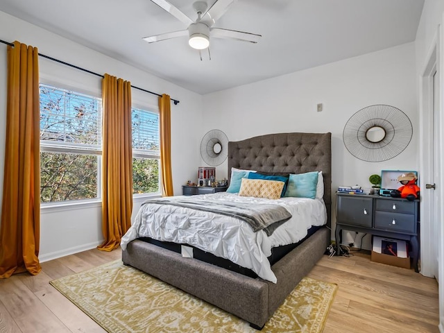 bedroom featuring ceiling fan and light hardwood / wood-style flooring