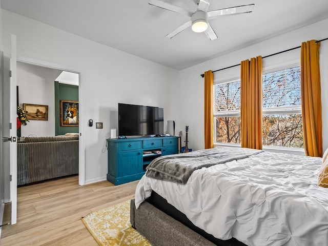 bedroom featuring light hardwood / wood-style flooring and ceiling fan