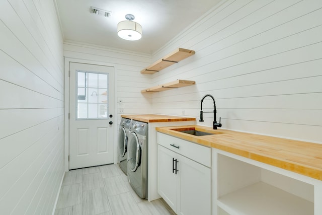 3585 Gardenview Way, Tallahassee, FL 32309 - laundry area featuring washer and clothes dryer and wooden walls