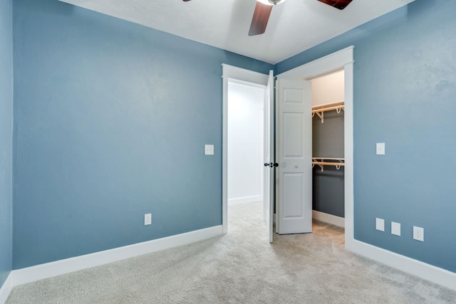 3585 Gardenview Way, Tallahassee, FL 32309 - unfurnished bedroom with a walk in closet, carpet flooring, a closet, and a ceiling fan