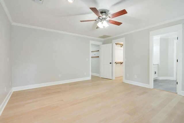 3585 Gardenview Way, Tallahassee, FL 32309 - unfurnished bedroom featuring a walk in closet, light wood-style floors, ornamental molding, ensuite bath, and ceiling fan