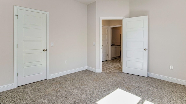 unfurnished bedroom featuring carpet flooring