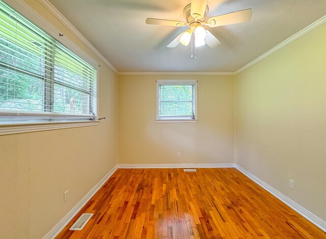 1514 Sharon Rd, Tallahassee, FL 32303 - empty room with wood finished floors, ceiling fan, and ornamental molding