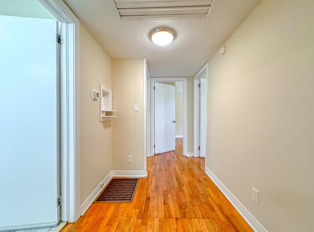 1514 Sharon Rd, Tallahassee, FL 32303 - hallway featuring light wood finished floors and baseboards
