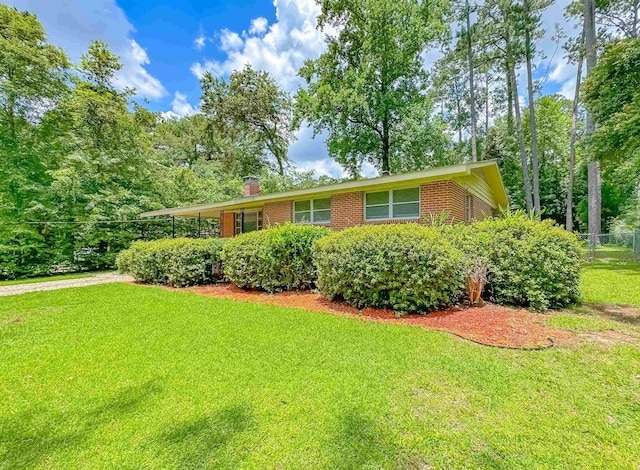 1514 Sharon Rd, Tallahassee, FL 32303 - ranch-style house with brick siding and a chimney