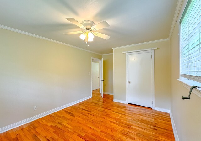 1514 Sharon Rd, Tallahassee, FL 32303 - unfurnished bedroom with light wood-style flooring, ornamental molding, and a ceiling fan
