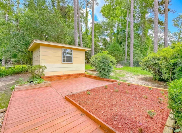 1514 Sharon Rd, Tallahassee, FL 32303 - deck featuring an outbuilding and view of wooded area