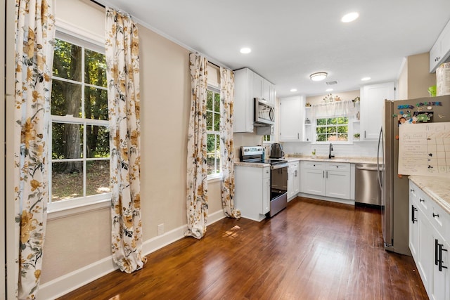 705 N 11th St, Quincy, FL 32351 - kitchen featuring stainless steel appliances, healthy amount of natural light, dark wood finished floors, and recessed lighting