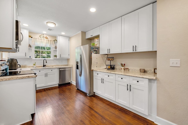 705 N 11th St, Quincy, FL 32351 - kitchen featuring stainless steel appliances, open shelves, a sink, light countertops, and recessed lighting