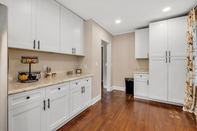 705 N 11th St, Quincy, FL 32351 - kitchen with baseboards, dark wood-style flooring, white cabinetry, recessed lighting, and light stone countertops